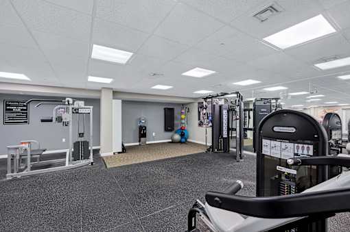Gym with a variety of equipment including weights at Columbia Pointe, Columbia, MD, Maryland , 21045