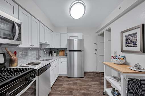Kitchen with white cabinets and a stainless steel refrigerator at Columbia Pointe, Maryland , 21045
