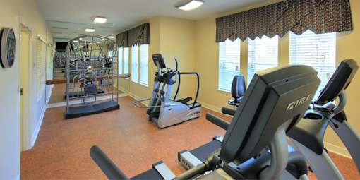 Gym with Elliptical Machines at Hammarlee House Apartments, Glen Burnie, MD, 21060