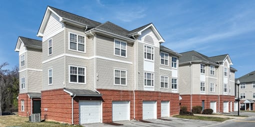 a row of town houses with garage doors at Overland Gardens, Maryland, 20785