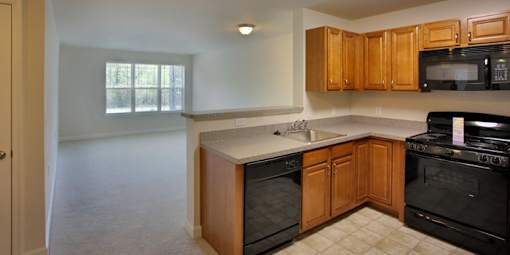 Kitchen with Black Appliances at Perryman Station Apartments, Maryland