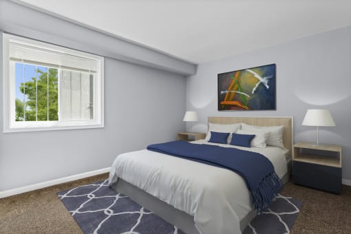 a bedroom with a bed and two nightstands