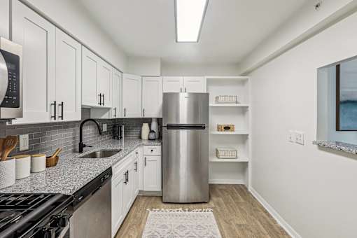 White Cabinetry And Appliances In Kitchen at Columbia Pointe, Maryland 