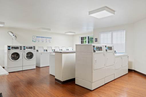 A laundromat with washers and dryers.