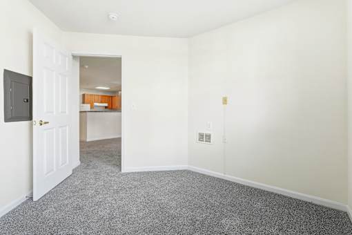 A room with a doorway leading to another room.