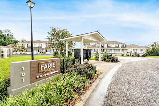 The image shows a sign for Faris located at the entrance of a residential area.