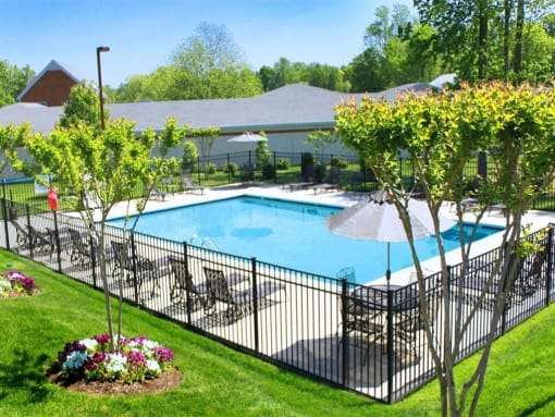 a swimming pool with a fence around it at Chesterfieldfield Garden Apartments, Chesterfield, VA, 23836