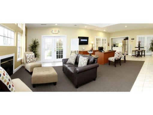 a living room filled with furniture and a fire place at Chesterfieldfield Garden Apartments, Chesterfield