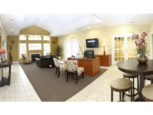 a living room filled with furniture and a flat screen tv at Chesterfieldfield Garden Apartments, Virginia