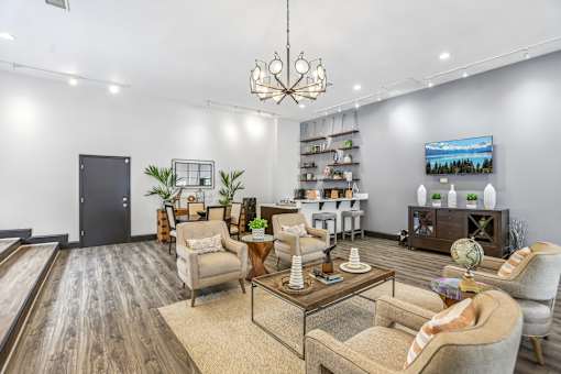 A modern living room with a wooden floor and furniture.