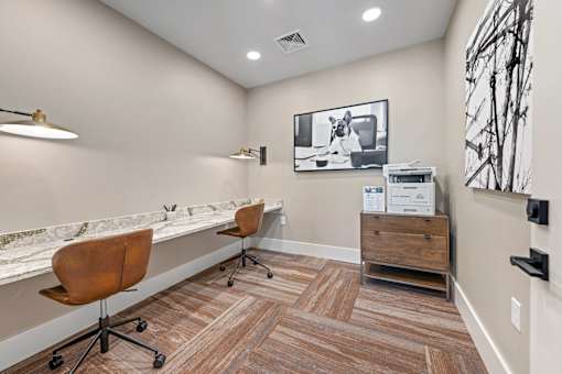 A room with a brown chair and a brown wood floor.