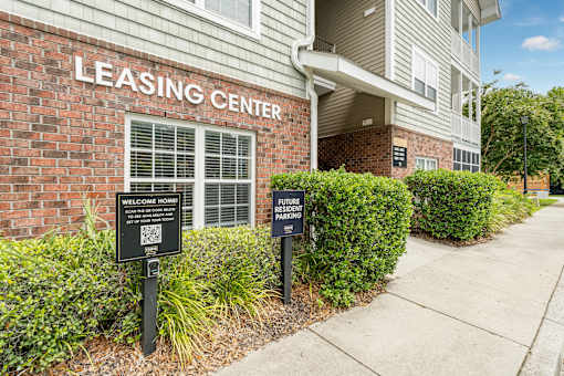 A building with a sign that says Leasing Center.