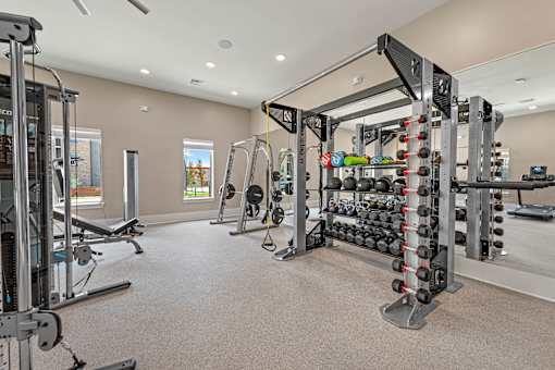 A spacious home gym with a variety of equipment.