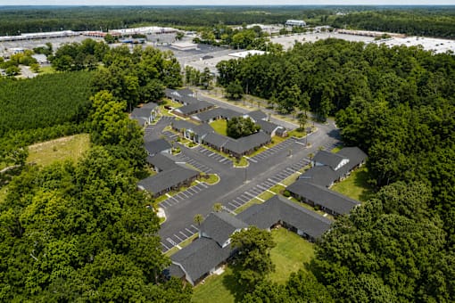A large complex of buildings surrounded by trees.