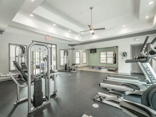 fitness center with exercise equipment  at Avenues of Kennesaw East & West, Kennesaw, GA