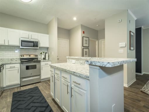 a renovated kitchen with an island  at Avenues of Kennesaw East & West, Kennesaw Georgia
