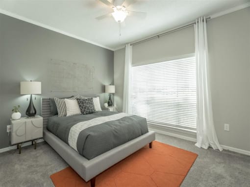 a bedroom featuring a large window at avenues of kennesaw at Avenues of Kennesaw East & West, Kennesaw, GA 30144
