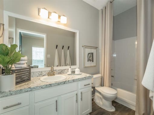 a bathroom with vanity at avenues of kennesaw  at Avenues of Kennesaw East & West, Kennesaw, GA