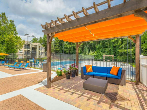 a lounge by the pool at avenues of kennesaw at Avenues of Kennesaw East & West, Kennesaw