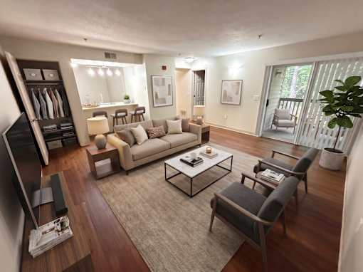 A living room with a couch, chairs, and a television.