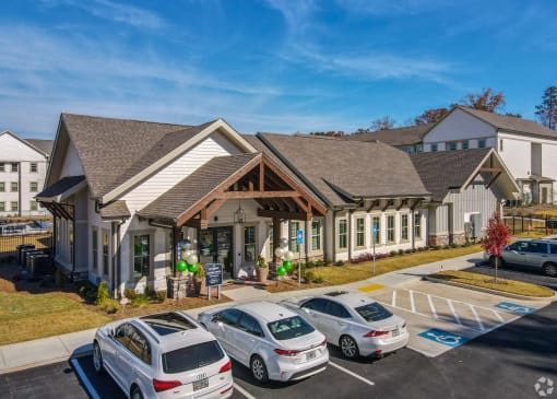 a building with a parking lot in front of it