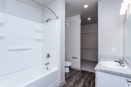 a bathroom with a bathtub and a sink