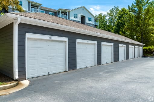 a row of garages in front of a house
