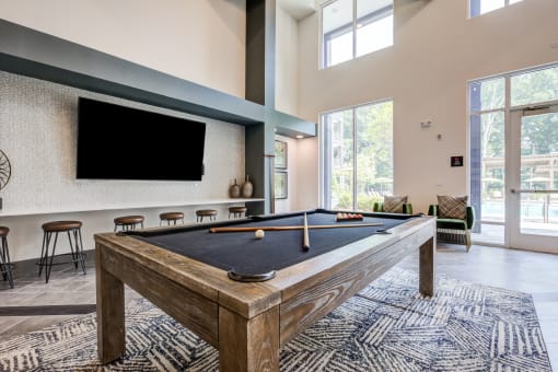 our apartments have a game room with a pool table and flat screen tv