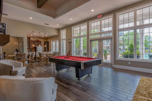 a game room with a pool table