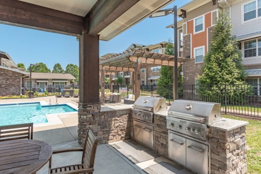 the preserve at ballantyne commons outdoor kitchen with a pool