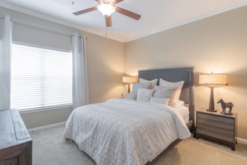 a bedroom with a bed and a ceiling fan at Century South Shore, Texas, 77573