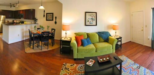 a living room with a couch and a table at Chester Village Green Apartments, Chester, 23831