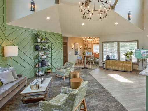 a living room with couches and chairs and a table