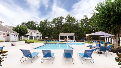 our apartments have a large pool and lounge chairs at Magnolia Place at Stockbridge Apartments, Stockbridge, Georgia