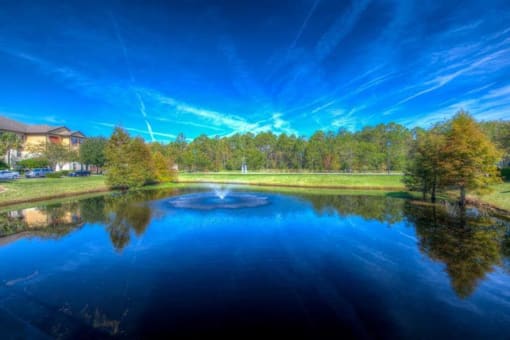 Large Lake with Fountains and Trail Including Outdoor Exercise Equipment at Century Bartram Park, Florida