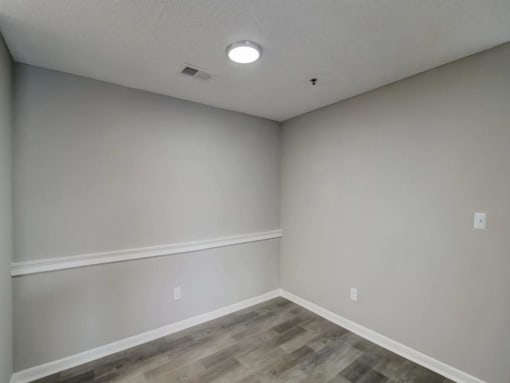 the interior of a room with white walls and wood floors at The Sapphire, Decatur, GA, 30035