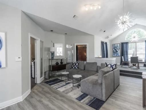 a living room with a couch and a table at The Sapphire, Decatur, GA