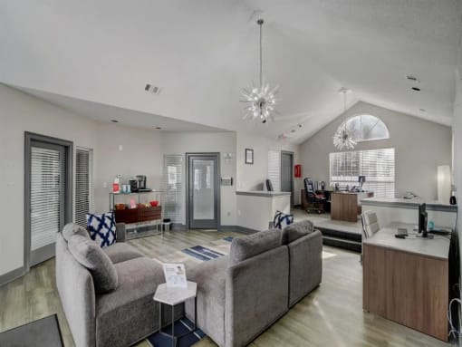 a living room with couches and a table at The Sapphire, Decatur