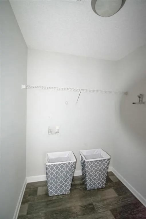 a bathroom with two baskets on the floor at The Sapphire, Decatur, GA