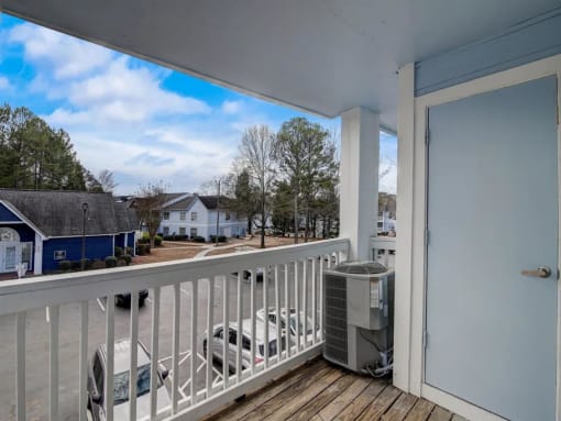 the view from the deck of a house with a heater on the balcony at The Sapphire, Georgia, 30035