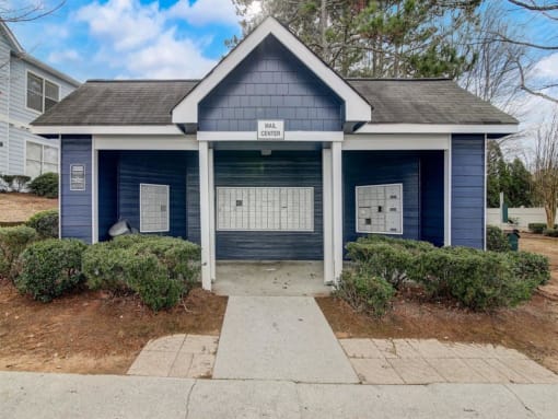 a small blue house with a sidewalk in front of it at The Sapphire, Decatur, GA, 30035