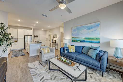 a living room with a couch and a coffee table at Century Mundy Mill Apartments, Oakwood, GA
