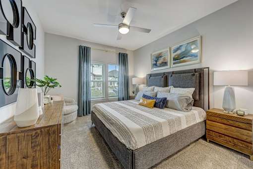 a bedroom with a bed and a window at Century Mundy Mill Apartments, Georgia 30566