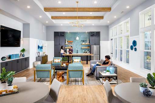 a living room filled with furniture and a kitchen at Century Mundy Mill Apartments, Oakwood, GA 30566