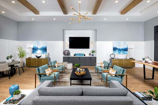 a living room with a couch and a table at Century Mundy Mill Apartments, Oakwood, GA 30566