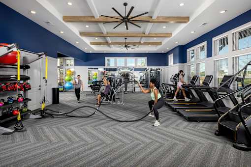 a group of people working out in a gym at Century Mundy Mill Apartments, Oakwood, GA 30566
