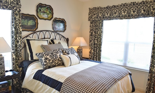Spacious bedroom with queen size bed and large window at the Haven at Market Street Station Johnson City, TN