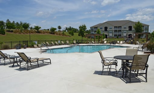 Sparkling pool with sundeck and lounge chairs at the Haven at Market Street Station Johnson City, TN