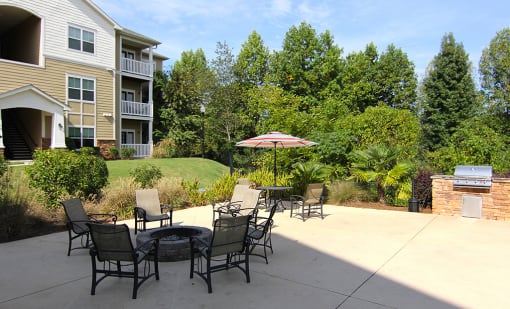 Courtyard with seating and firepit at the Haven at Reed Creek Apartments Martinez, GA