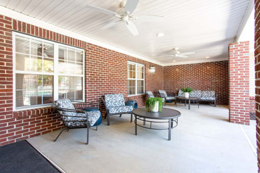 the preserve at ballantyne commons covered patio with chairs and a table